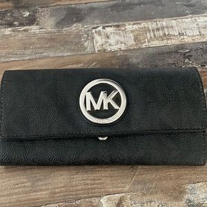 Michael Kohrs clutch wallet in good condition